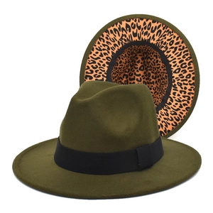Detail of olive green fedora hat featuring black ribbon and stylish leopard print lining