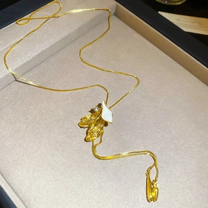 Detail of French enamel petal pendant with gold hollow accents and small zircons