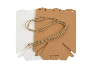 Close-up of unfolded kraft paper gift boxes in white and brown with natural jute twine cord