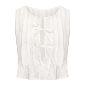 Detail of white sleeveless cotton top with bow ties and vertical pintuck pleats