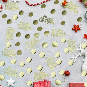 Close-up of golden Christmas confetti sequins with Merry Christmas text on a festive background