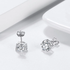Macro shot of 8mm round six-prong S925 sterling silver stud earrings with sparkling cubic zirconia
