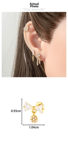 Detail of golden bow earring with micro-paved cubic zirconia showing size measurements