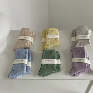 Six-pack of colorful confetti knit cotton mid-calf socks for women in soft pastel tones