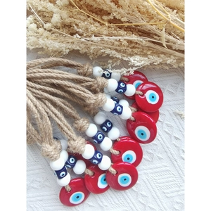 Handmade woven hemp rope wall hanging with traditional blue Turkish evil eye charms