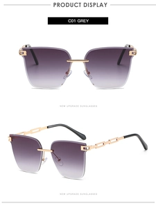 Detail of rimless gradient grey sunglasses with gold hollow metal chain temples