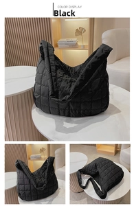 Detail view of black quilted space cotton tote bag with smooth zipper and padded strap