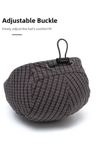 Close-up of adjustable drawstring buckle on plaid flat cap for custom head size fit