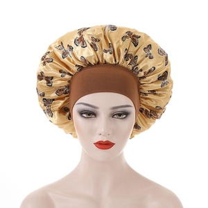 Detail of butterfly pattern on satin sleep bonnet with high elastic wide headband