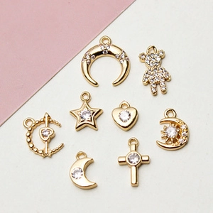Selection of gold-plated moon and star charms with zirconia for DIY jewelry making