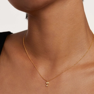 18K gold S925 silver key necklace with sparkling zircon crystals on a female neck