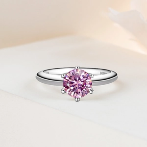 Macro shot of S925 hallmark and D1.00ct engraving on a pink moissanite ring band
