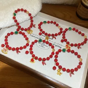 Red glass bead bracelet with golden horse charm and Chinese zodiac elements