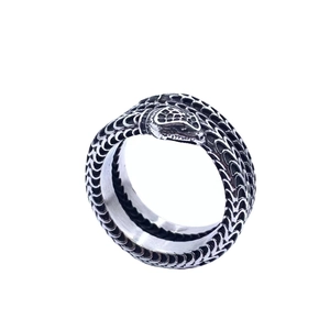 Vintage stainless steel ouroboros ring with detailed snake scale texture in silver and black