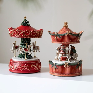 Exquisite resin Christmas carousel and tree music boxes with Santa Claus in festive colors