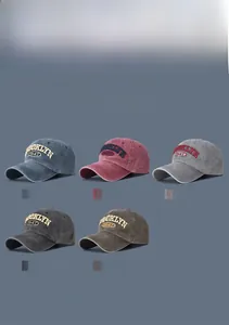Detailed close-up showing five colors of washed cotton baseball caps with 1947 embroidery