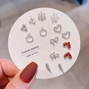 Detail of Korean style titanium steel earring set with heart, star and bow designs