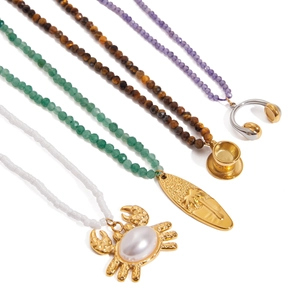 Layered titanium steel necklaces with colorful gemstone beads and gold animal pendants