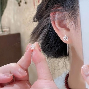 Elegant silver snowflake drop earrings with sparkling cubic zirconia on long chain