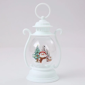 Detailed view of a white Christmas lantern featuring snowman and winter tree illustrations