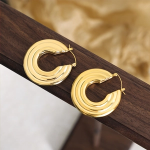 Elegant gold chunky hoop earrings with textured concentric rib design for women