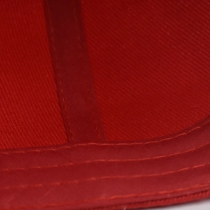 Macro shot of red embroidery stitching details on the Canada baseball cap brim