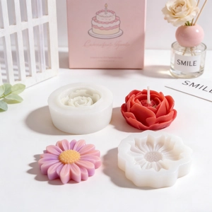 Silicone molds for flower shaped DIY candles featuring roses and daisies with gift box