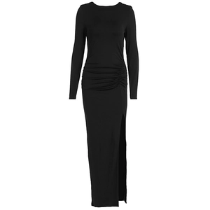 Detail of the side waist pleats and side slit on this slim fit black long sleeve dress