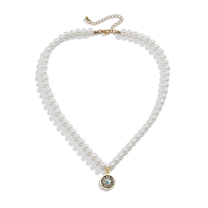 Men's pearl necklace with gold sun pendant and blue turquoise center on white background