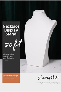 Detailed view of white leather mannequin bust stand for elegant necklace display