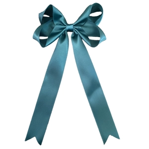 Detailed view of peacock blue grosgrain ribbon bow hair clip with long swallowtail streamers