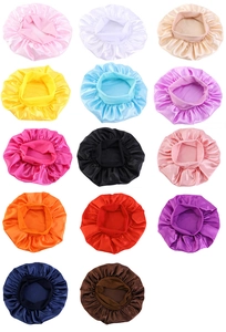 Array of wide-brimmed satin hair caps in 14 various vibrant colors on white background