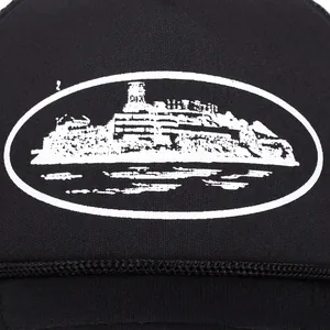 Detailed macro view of Alcatraz Island screen print on black mesh trucker cap fabric