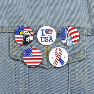Close-up of five enamel patriotic badges pinned on a denim jacket pocket with USA motifs