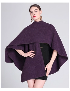 Deep purple wool knit poncho featuring a stylish asymmetrical drape and premium texture