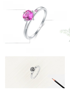 Close-up of heart-shaped pink zircon and 925 sterling silver stamp on the polished ring