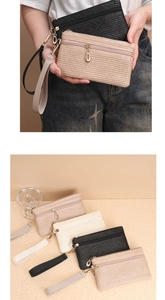 Details von geflochtenen Stroh-Clutches in Beige Schwarz Creme und Rosa mit Schlaufe