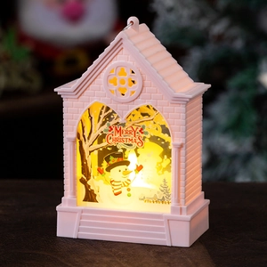 Close-up of pink Christmas lantern with snowman illustration and warm LED glowing light