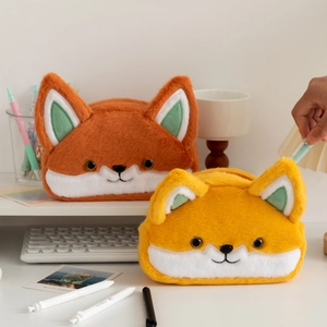 Detailed close-up of cute plush fox storage bags with soft fur texture and embroidered faces