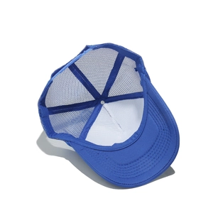 Interior detail of blue mesh trucker hat showing snapback closure and mesh texture