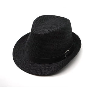 Close-up of black straw fedora with fine weave texture and metal buckle detail