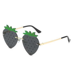 Quirky strawberry shaped sunglasses with green leaf accents and gold metal temples