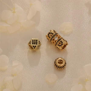 Gold-plated beads with black cubic zirconia on white silk for jewelry making