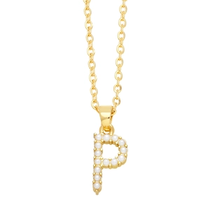Detail of a gold letter P necklace pendant featuring white round pearls on a metal chain