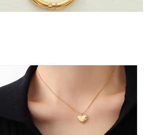 Close-up of gold clasp and lifestyle view of model wearing a heart pendant necklace