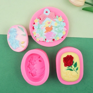 Pink silicone molds for DIY floral soaps and candles with orchid and rose relief patterns