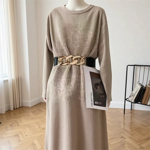 Beige ribbed knit long sleeve dress featuring a stylish wide black belt with gold chain link