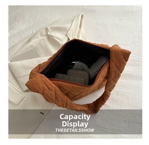 Spacious caramel corduroy quilted tote bag showing interior storage capacity and items