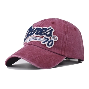 Close-up of vintage washed burgundy baseball cap with 3D Original 76 embroidery