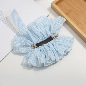 Detail of light blue striped bow hair clip with pleated fabric and metal spring clasp